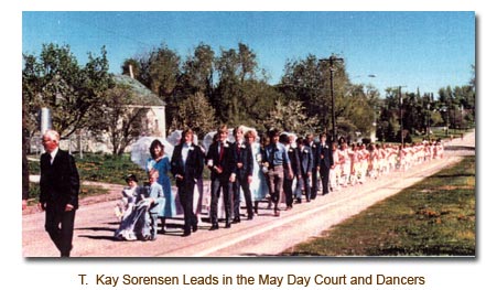 T. Kay Sorensen leads in the 1986 May Day Court and May Day Dancers.