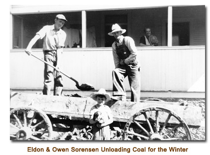 Eldon & Owen Sorensen unloading coal for the winter.